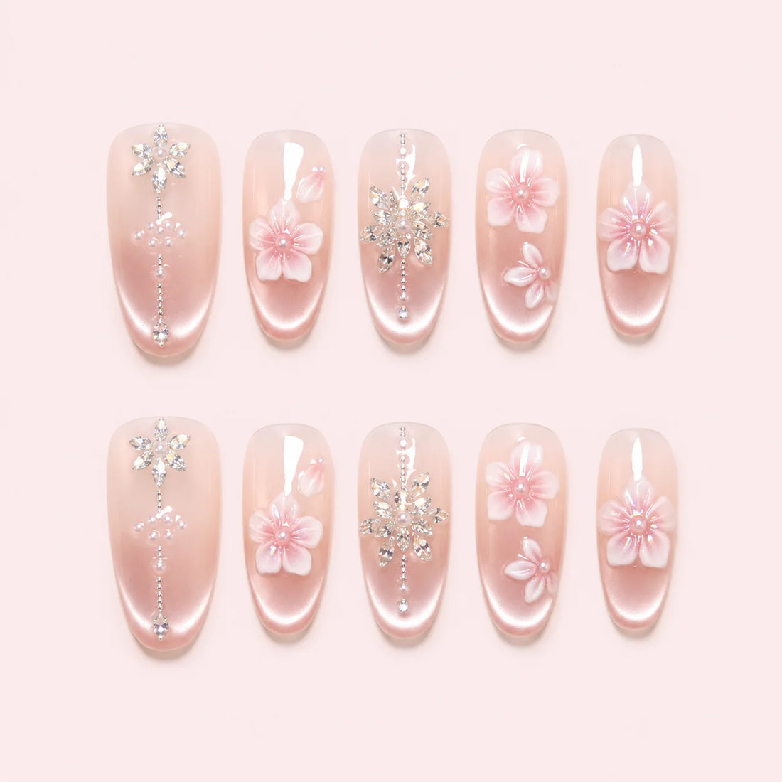 Petal Chandelier pink and white oval nails with layered flowers and silver botanical details