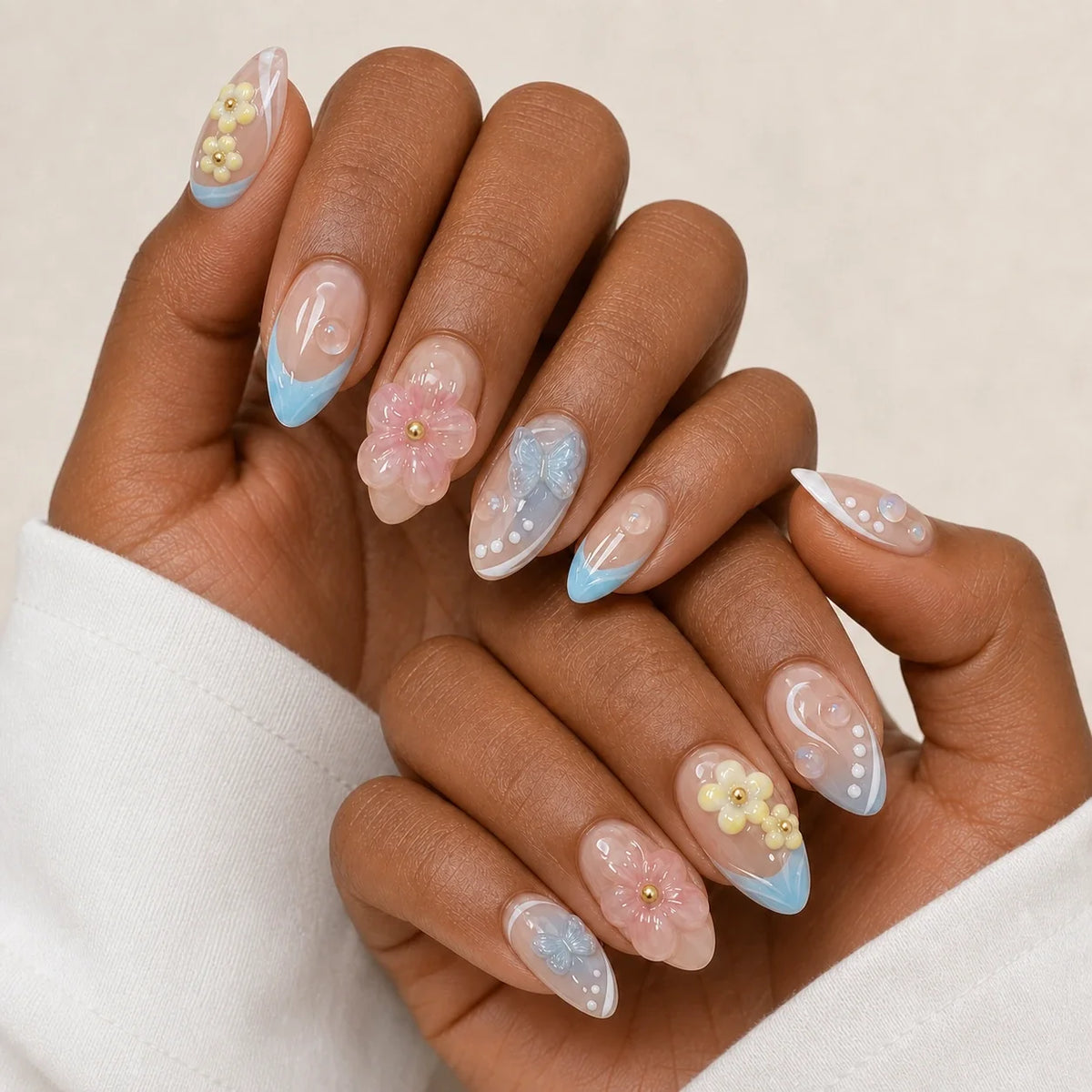 Poolside Alchemy 3D flower manicure on two medium-brown hands