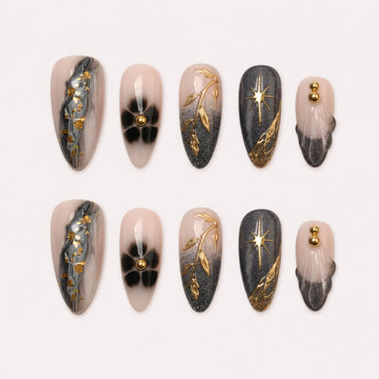 Astral Petal charcoal blush and gold medium almond press-on nails product display