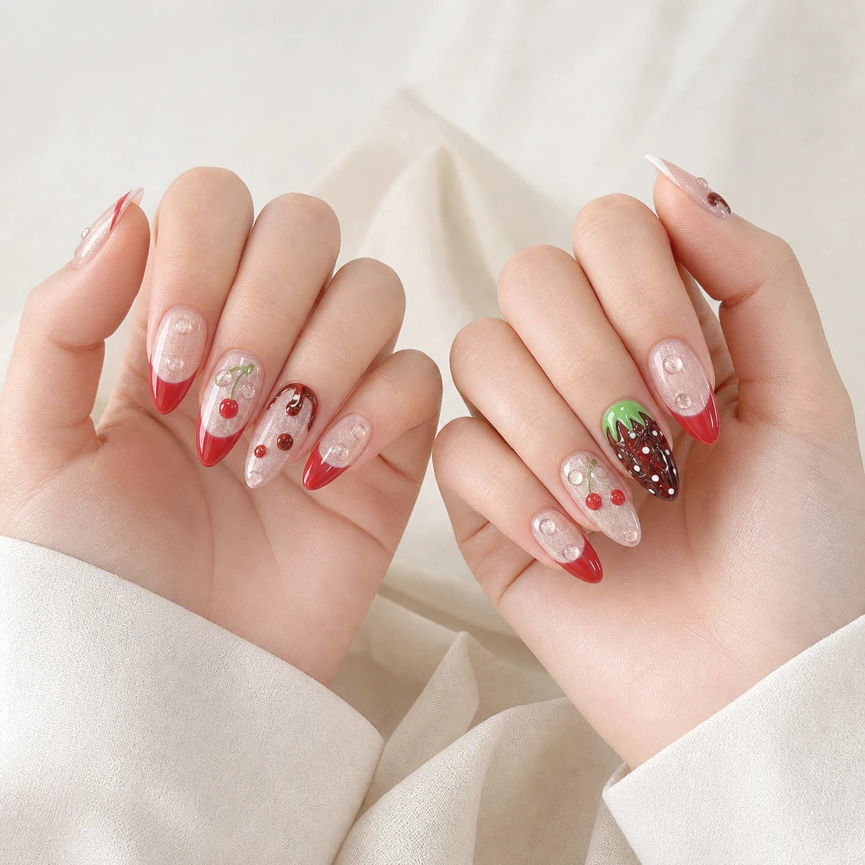 Berry Ganache red chocolate fruit long almond press-on nails on two softly curled hands
