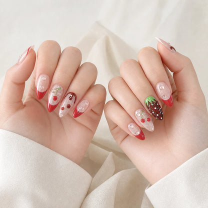 Berry Ganache red chocolate fruit long almond press-on nails on two softly curled hands