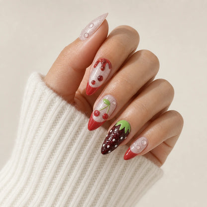 Berry Ganache chocolate strawberry nails on one curled hand