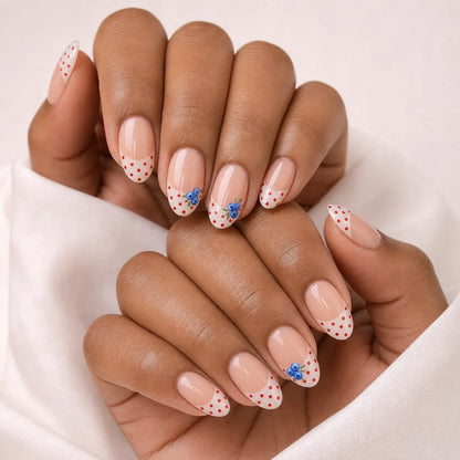Blueberry Polka fruit nails on two medium-brown hands
