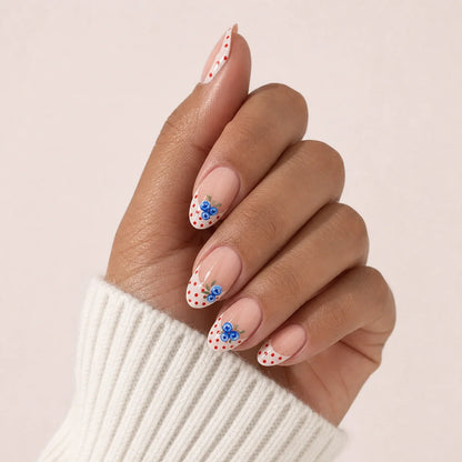 Blueberry Polka blueberry manicure on one medium-brown hand
