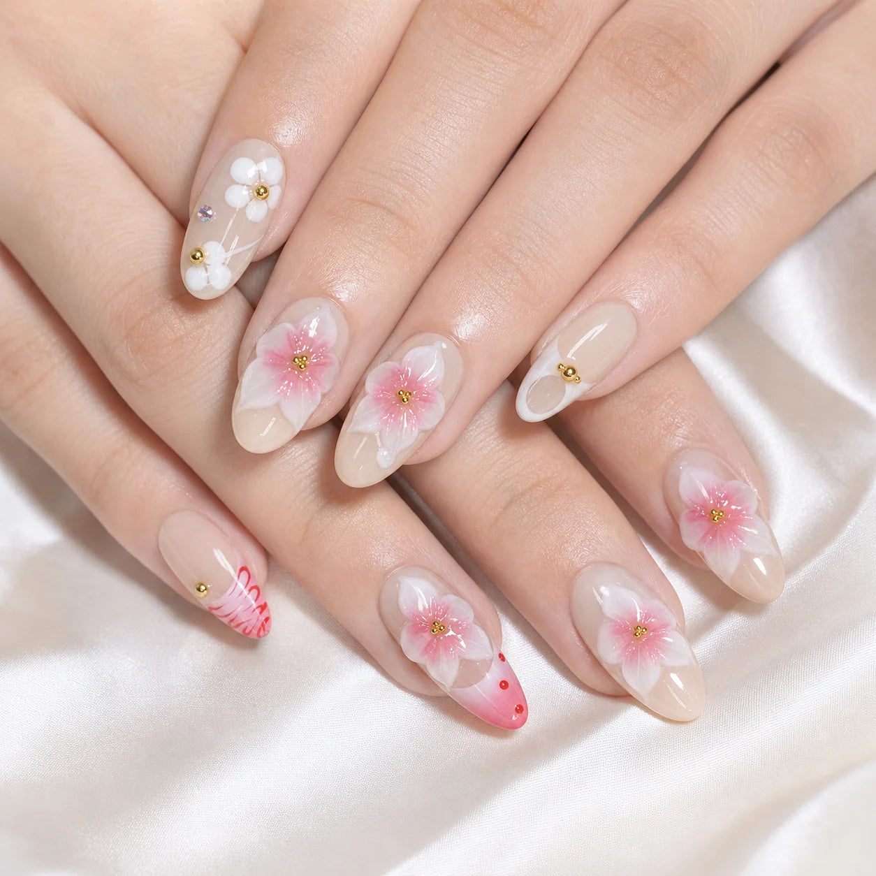 Blush Floralia medium almond floral press-on nails on two gently stacked hands, new option