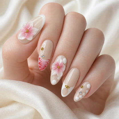 Blush Floralia medium almond floral press-on nails on one softly curled hand, new option