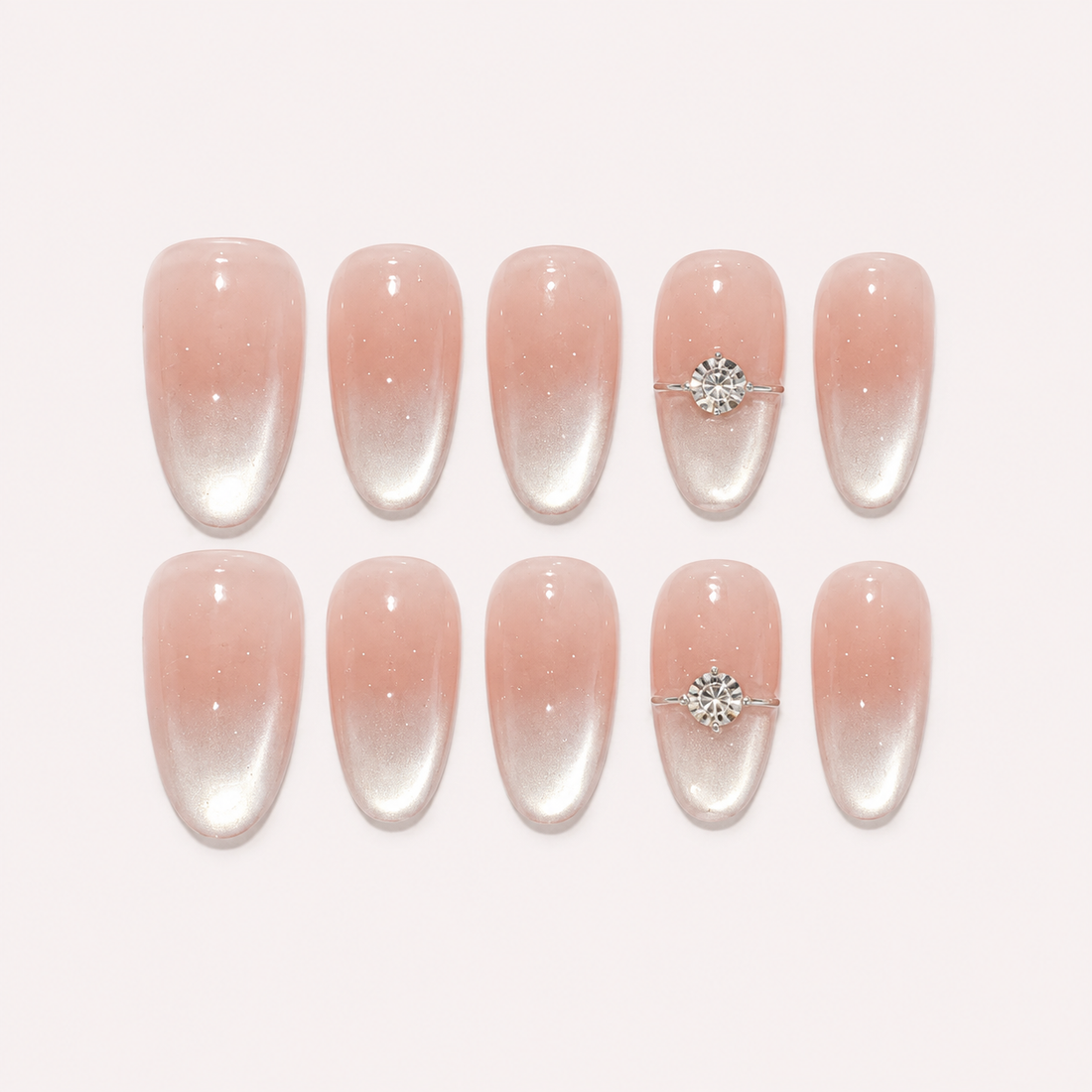 Blush Solitaire Medium Oval nude blush cat-eye press-on nails with silver tips and crystal accents