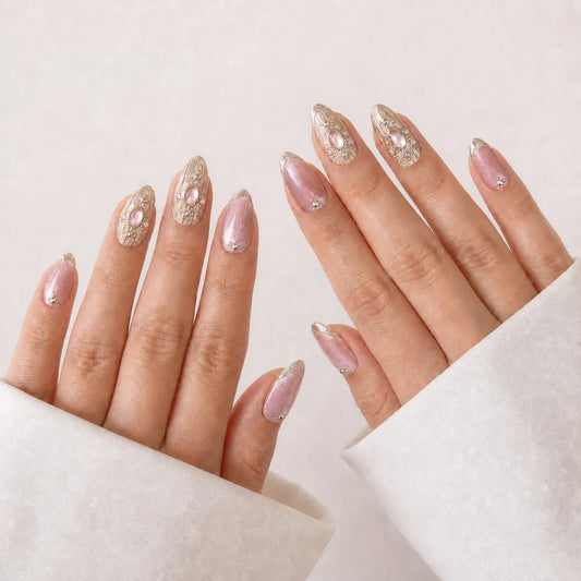 Champagne Oracle medium almond press-on nails on two open hands