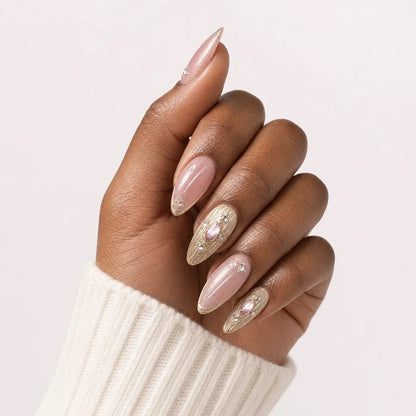 Champagne Oracle medium almond manicure on one medium-brown hand