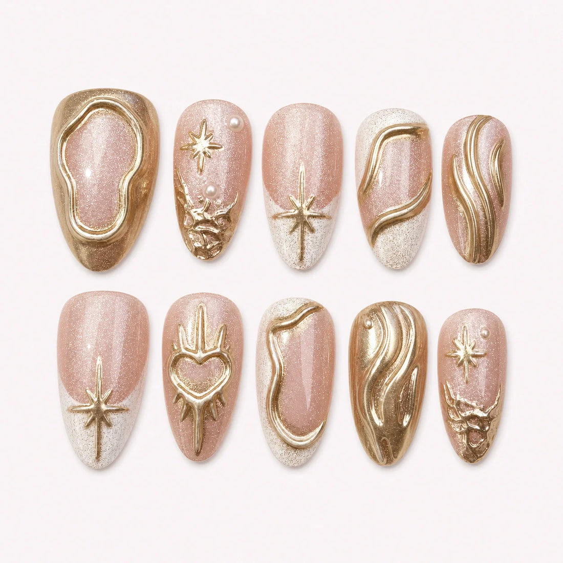 Champagne Zodiac gold chrome medium almond press-on nails on a pale blush background