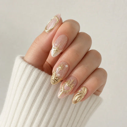 Champagne Zodiac gold chrome manicure on one curled hand