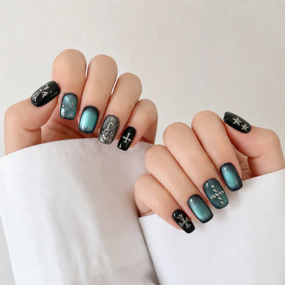 Cross Current cat eye manicure on two softly curled hands