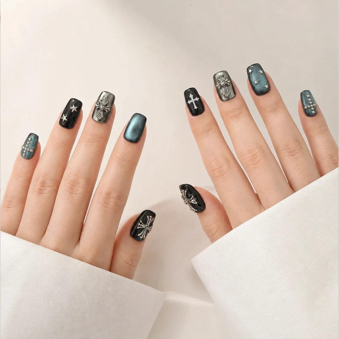 Cross Current short square press-on nails on two open hands