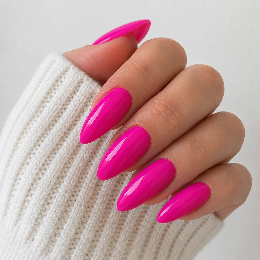 Dragonfruit Crush medium almond pink press-on nails close-up showing the glossy finish