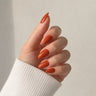 Ember Silk medium almond orange press-on nails by Matchy Nails