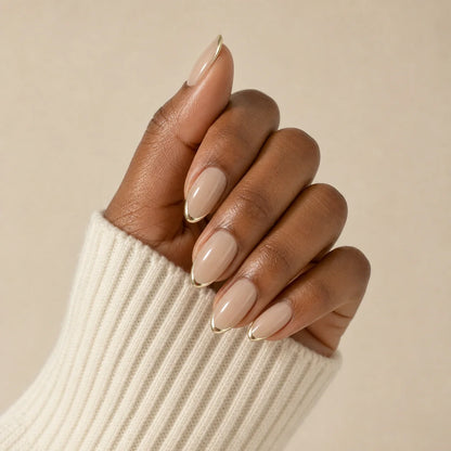 Gilded Whisper minimalist gold manicure on one medium-brown hand