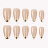 Gilded Whisper nude beige medium almond press-on nails with gold micro-French tips