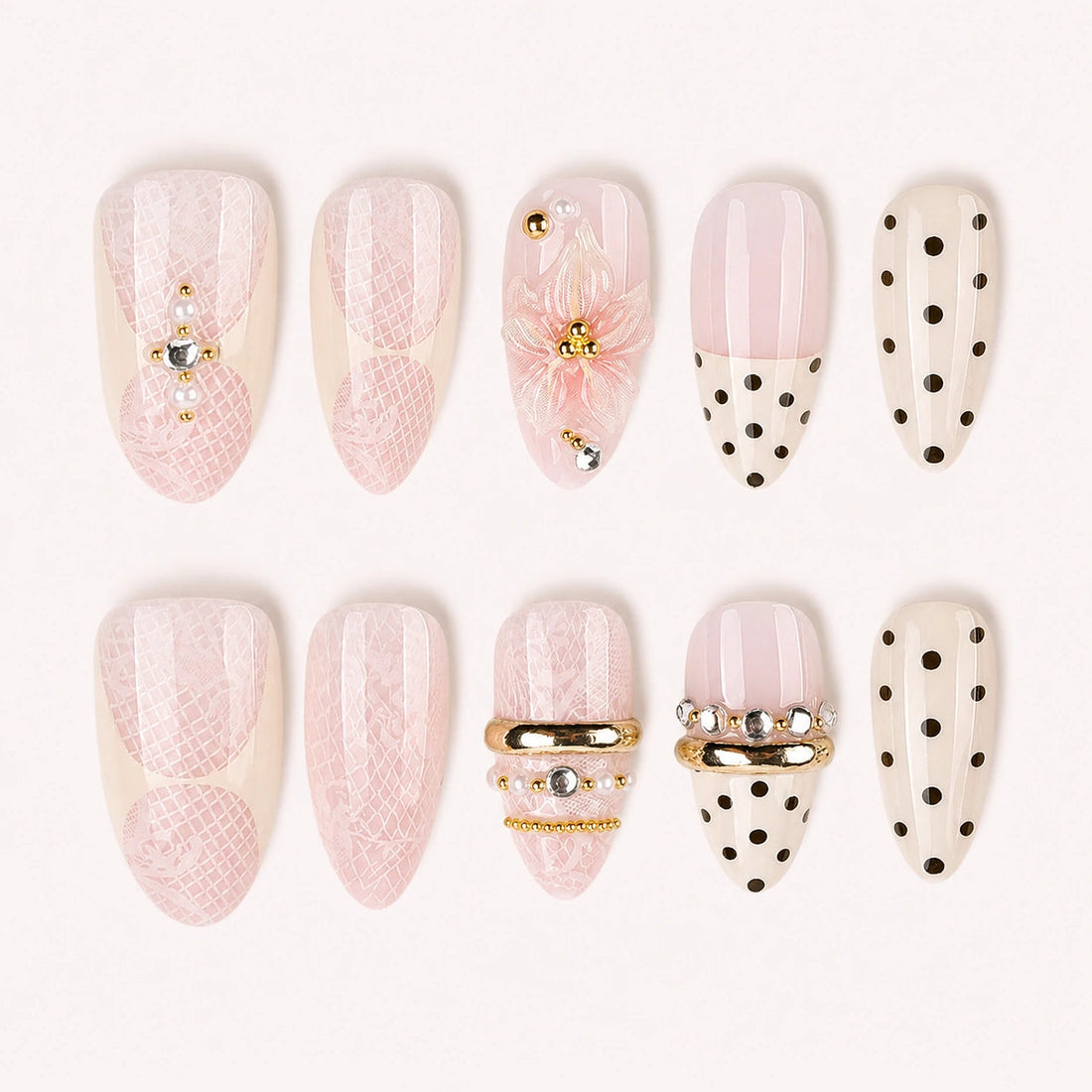 Lace Confetti pink ivory lace polka dot short almond press-on nails, ten-piece product display on pale warm background