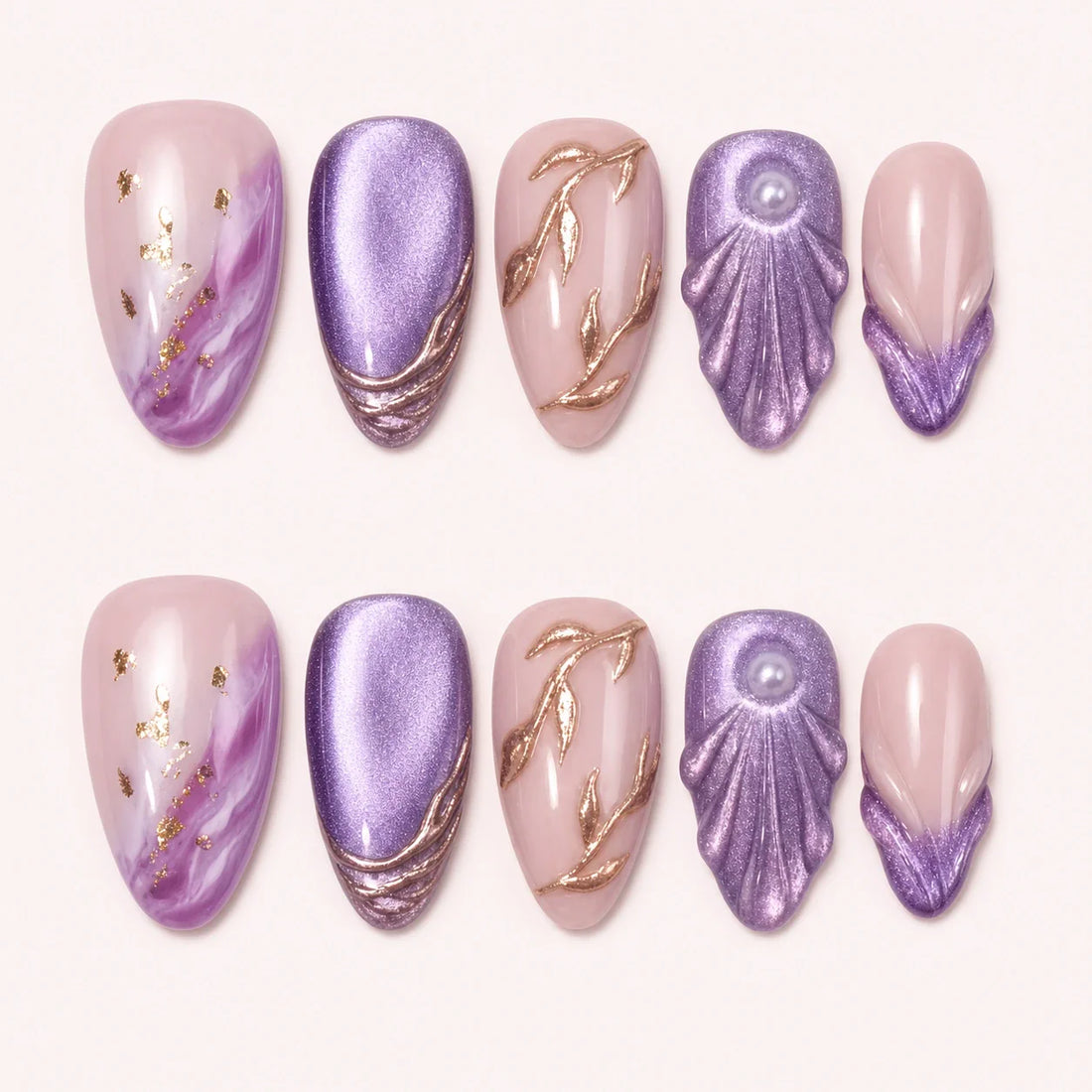 Lavender Grotto medium almond press-on nails in violet and blush with rose-gold shell details