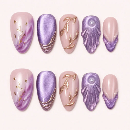 Lavender Grotto medium almond press-on nails in violet and blush with rose-gold shell details