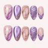 Lavender Grotto medium almond press-on nails in violet and blush with rose-gold shell details