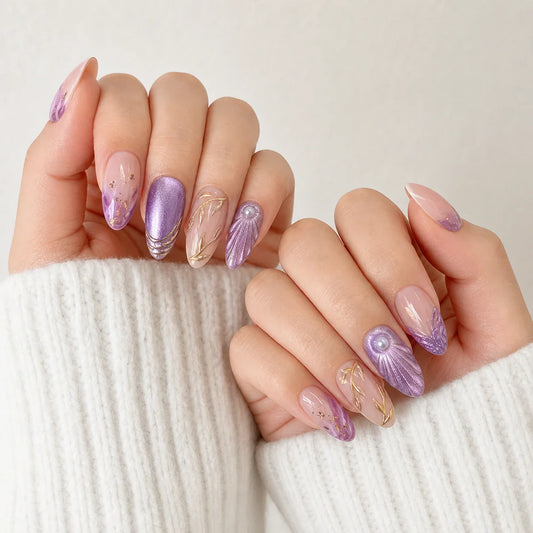 Lavender Grotto violet cat-eye and shell press-on manicure on two softly curled hands