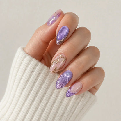 Lavender Grotto violet and blush press-on manicure on one softly curled hand