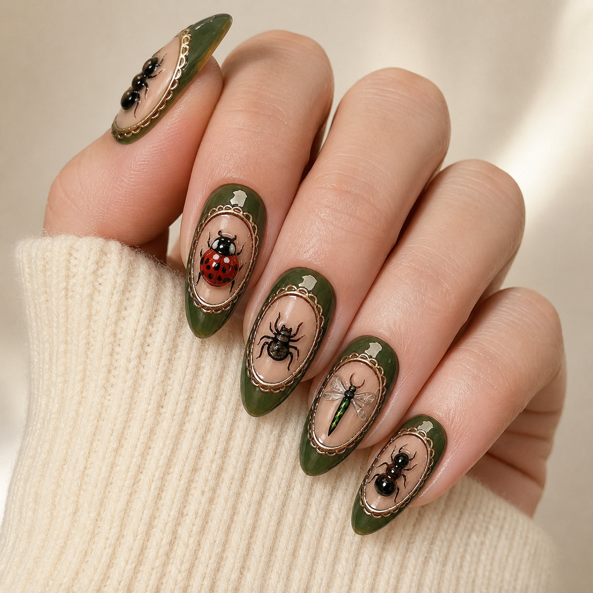 Beetle Cabinet press-on nails shown on light-skinned one hand