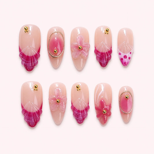 Cassis Tide press-on nails, full ten-piece set on a pale blush-white background