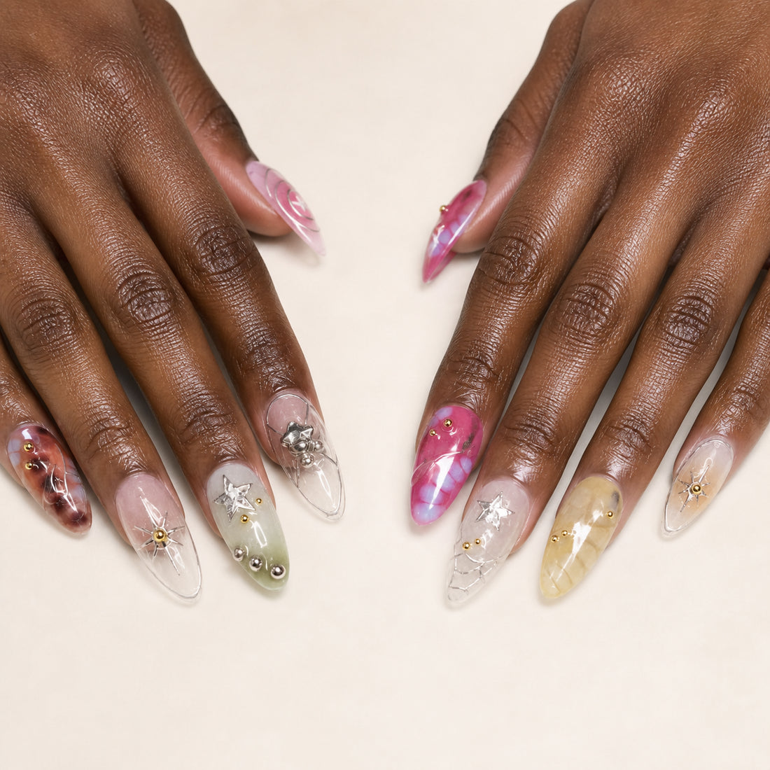 Cosmic Rosette press-on nails shown on dark-skinned two hands