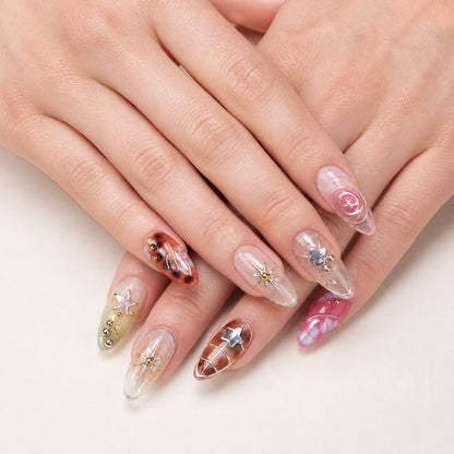 Cosmic Rosette press-on nails shown on light-skinned two hands
