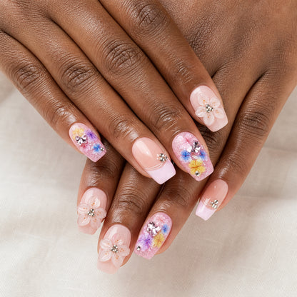 Firework Garden press-on nails shown on dark-skinned two hands