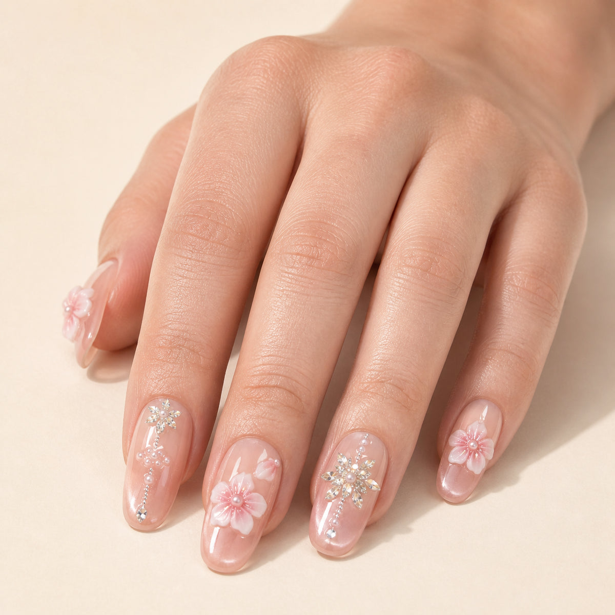 Petal Chandelier press-on nails shown on light-skinned one hand