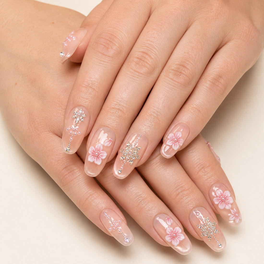 Petal Chandelier press-on nails shown on light-skinned two hands