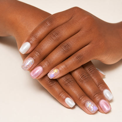 Petal Sprinkles press-on nails shown on dark-skinned two hands