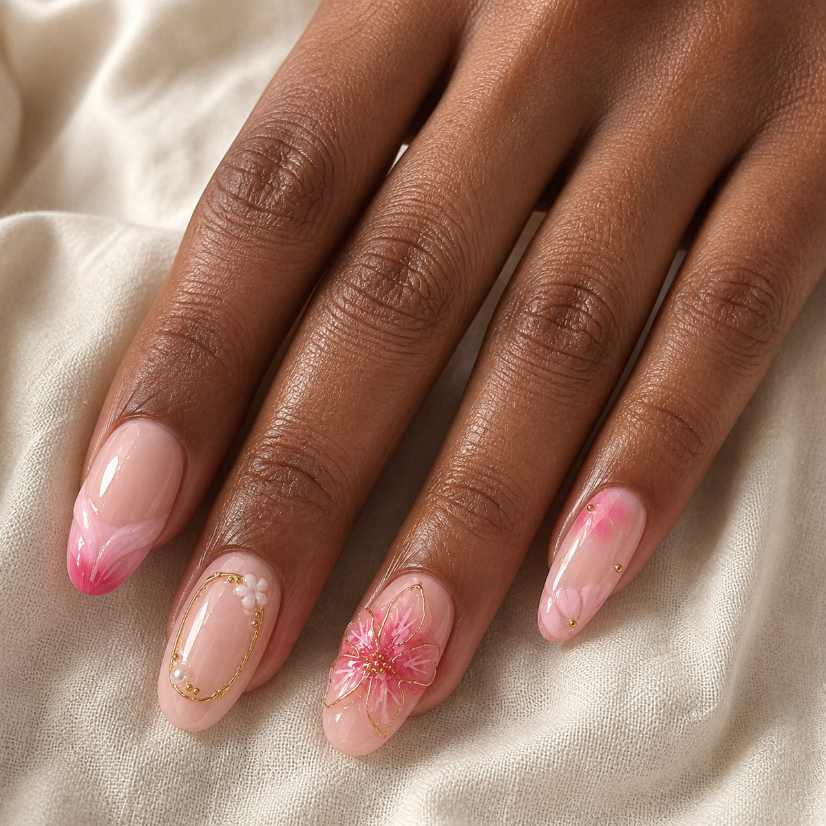 Rose Drift press-on nails shown on dark-skinned one hand