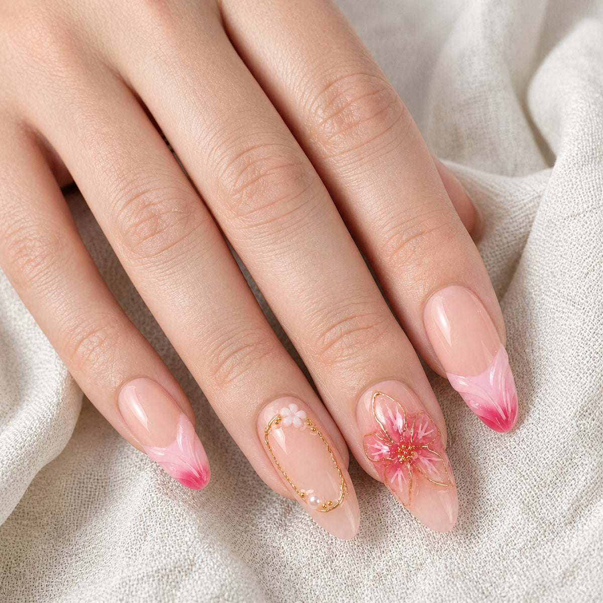 Rose Drift press-on nails shown on light-skinned one hand
