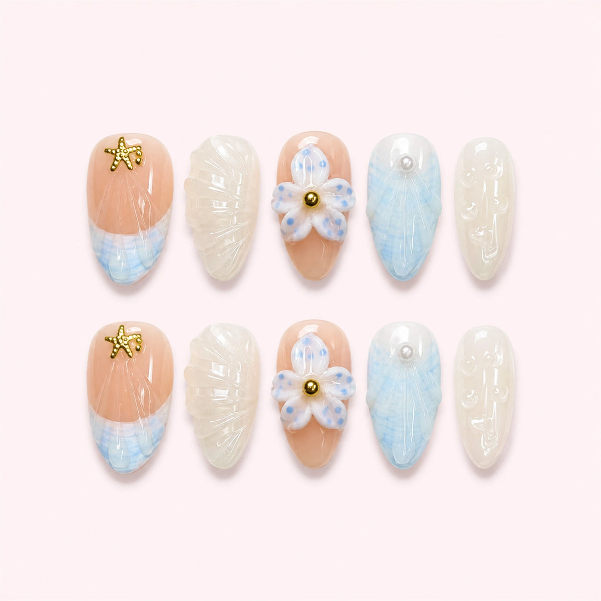 Tidal Picnic press-on nails, full ten-piece set on a pale blush-white background