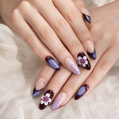 Velvet Eclipse press-on nails shown on light-skinned two hands