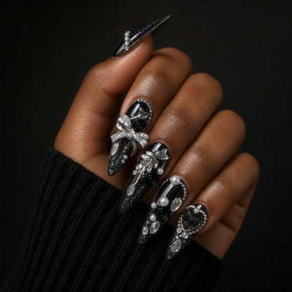 Midnight Heirloom gothic jewelled manicure on one medium-brown hand