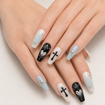 Two crossed hands wearing Mint Nocturne Long Coffin mint black and silver press-on nails
