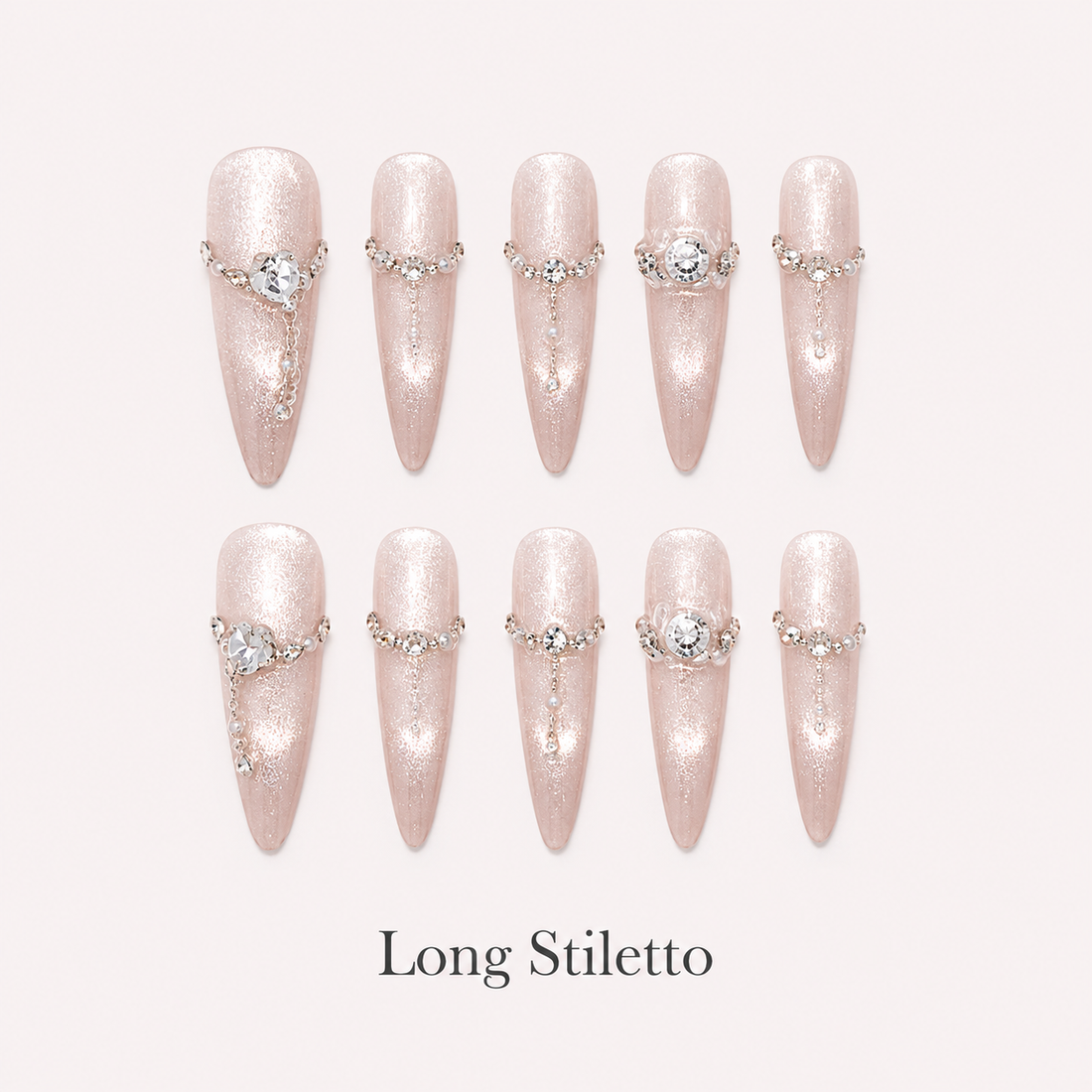 Moonlit Rosette Long Stiletto handmade press-on nails with champagne shimmer, chains and rose crystals
