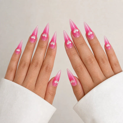 Neon Heartbeat long stiletto heart press-on nails on two open hands
