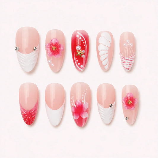 Petal Current long almond pink floral press-on nails on a pale blush background