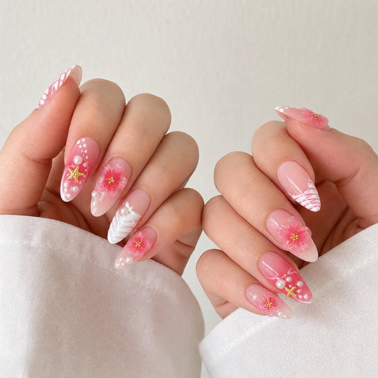 Petal Current pink 3D floral press-on manicure on two curled hands