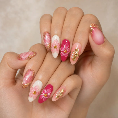 Petal Regalia 3D flower manicure on two softly curled hands