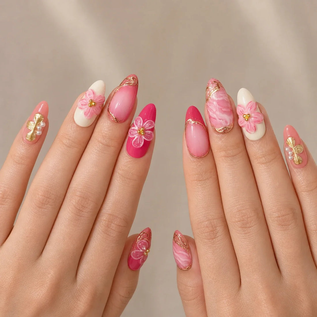 Petal Regalia medium almond press-on nails on two open hands