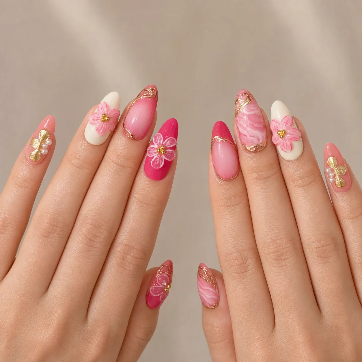 Petal Regalia medium almond press-on nails on two open hands