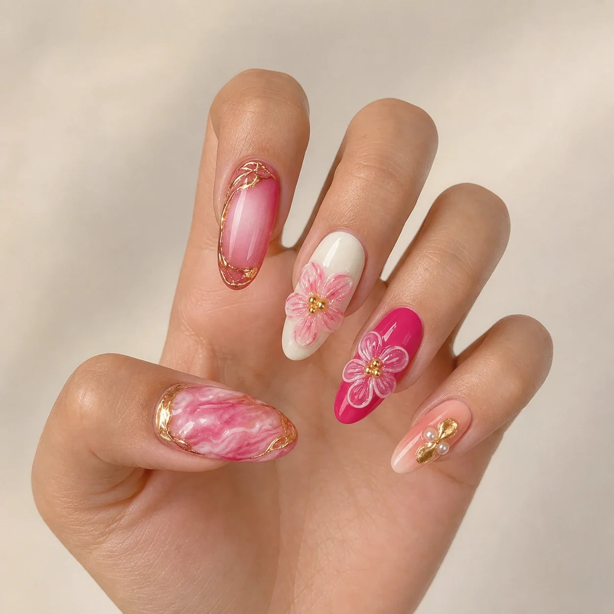 Petal Regalia fuchsia floral nails on one open hand