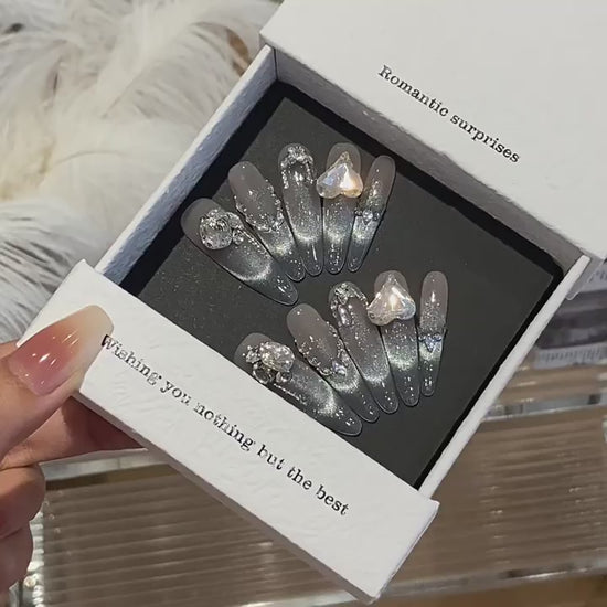 Diamond Haze product video showing nude silver cat-eye press-on nails with crystal accents